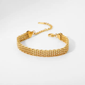 Gold-tone stainless steel chain bracelet with adjustable clasp on a white background